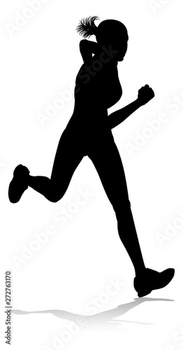 Silhouette runner in a race track and field event photo