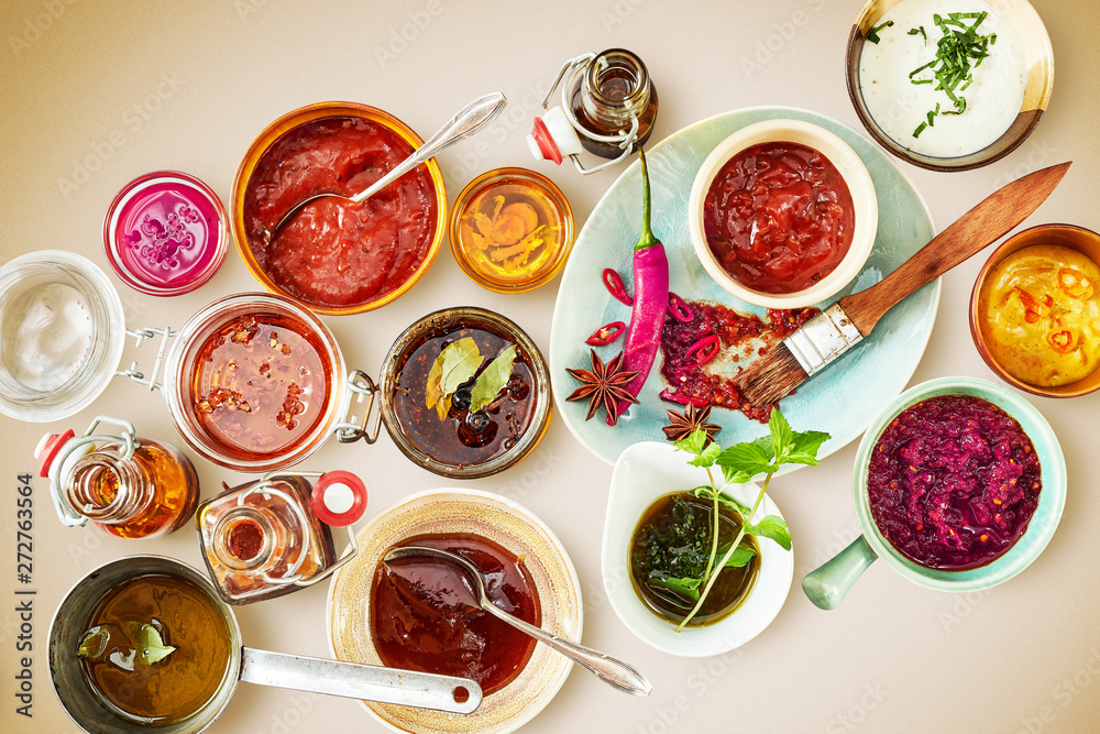 Overhead view of bowls and plates containing sauce Overhead view of bowls and plates containing sauce