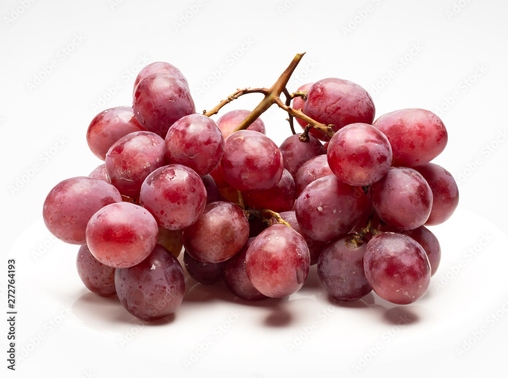 Red Grapes isolated over the white background.