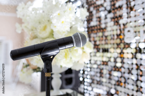 Microphone on the stand. Place to speak at the event. Holiday concept.