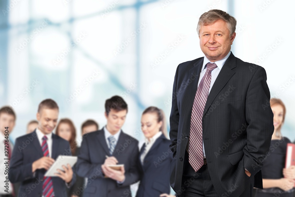 Smiling handsome businessman with crossed hands isolated Smiling handsome businessman with crossed hands isolated