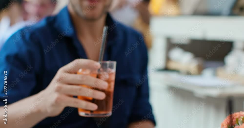Man drinking cocktail at happy hour aperitif in city cafe.Medium portrait shot Friends italian trip in Umbria.4k slow motion Man drinking cocktail at happy hour aperitif in city cafe.Medium portrait shot Friends italian trip in Umbria.4k slow motion