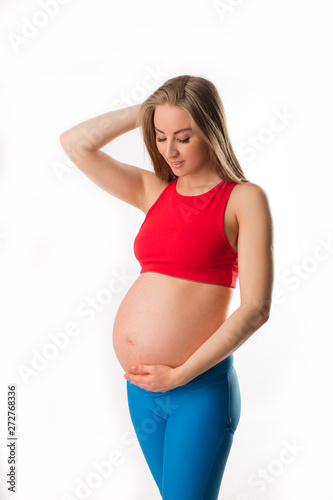 beautiful young pregnant woman on white background