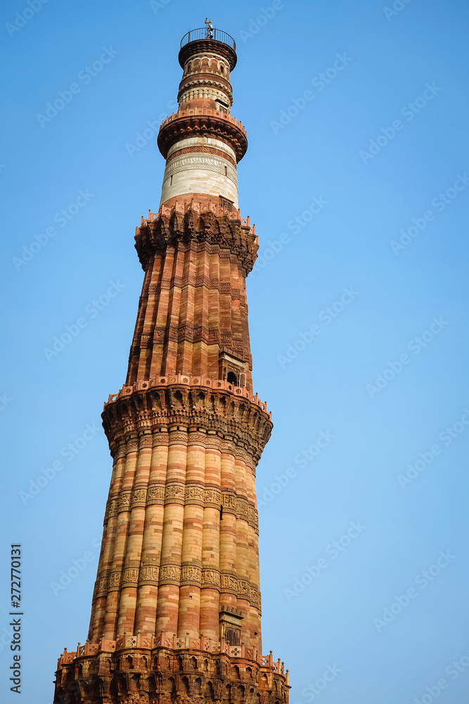 Qutab Minar, the tallest minaret in the world 73 metre tall tapering tower of five storeys made from sandstone bricks  in the Mehrauli area of Delhi, India