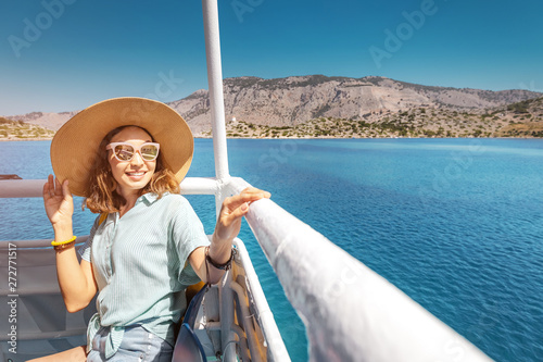 Fototapete Happy asian woman in hat enjoying travel and vacation on Cruise ship