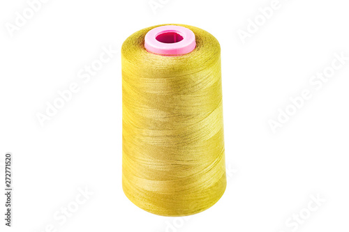 One twisted cylindrical new clean bobbin full of yellow synthetic threads isolated on white background