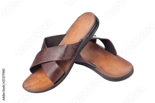 Pair of lightweight slippers for beach beside sea on vacation or domestic with two brown leather strips and plastic or rubber sole isolated on white background