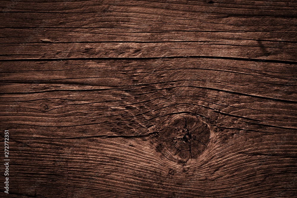 Naklejka premium Texture of dark brown old rough wood. Abstract background for design. Vintage retro