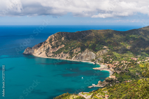 Scenic Italian Riviera landscape. Monterosso village and the surrounding mountains in Cinque Terre, Italy as seen from above.
