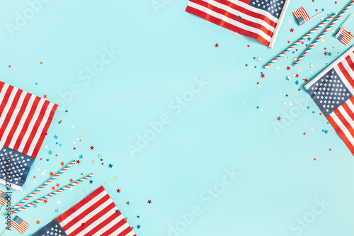4th of July American Independence Day decorations on blue background. Flat lay, top view, copy space