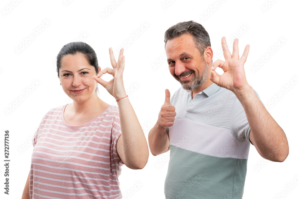 Couple making like and okay gestures with fingers Couple making like and okay gestures with fingers