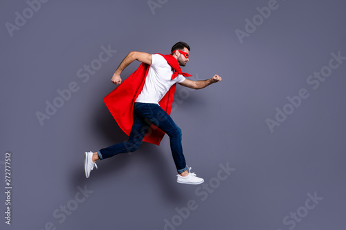 Full length body size view of his he nice-looking attractive content virile masculine sportive brutal bearded guy running fast isolated over gray pastel violet purple background © deagreez
