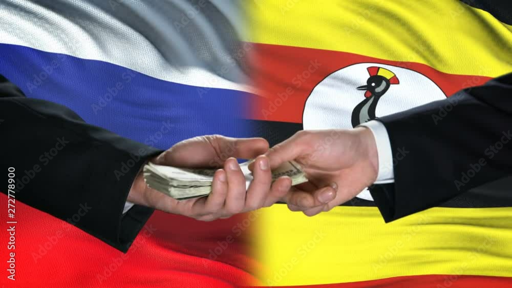 Russia and Uganda officials exchanging tank for money, flag background, deal