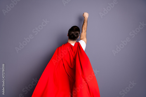 Rear back behind view portrait of his he nice cool content macho powerful guy life lifestyle goal purpose rising hand up isolated over gray violet purple pastel background photo