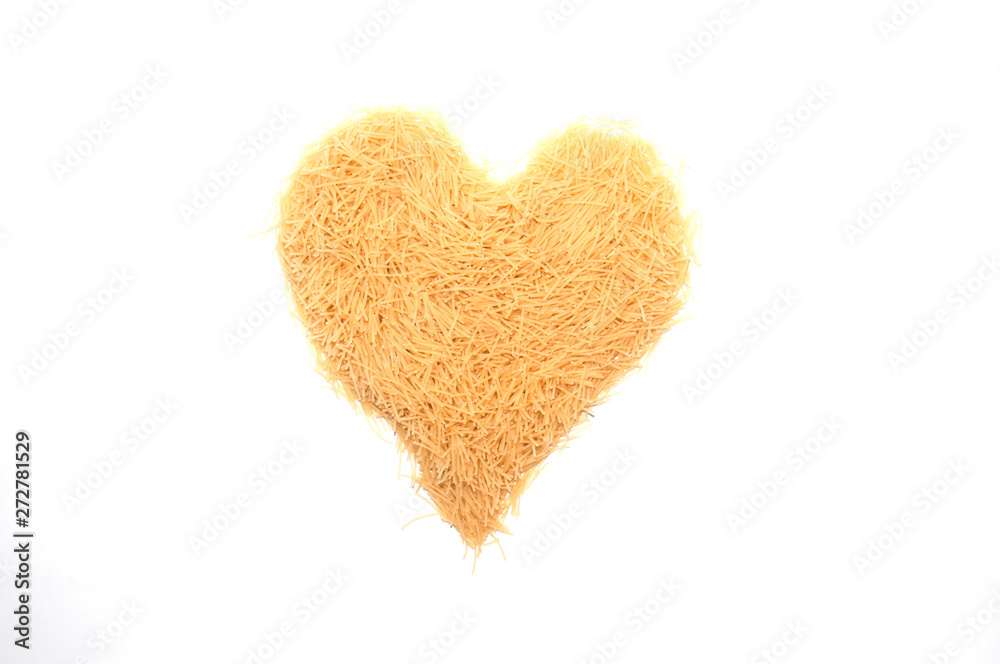 Vermicelli, heart-shaped pasta on a white background Vermicelli, heart-shaped pasta on a white background