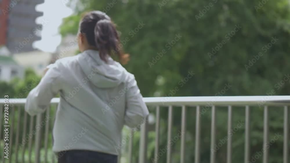 Beautiful young asian woman runner training in summer park. Sports woman running healthy lifestyle. Beautiful young asian woman runner training in summer park. Sports woman running healthy lifestyle.
