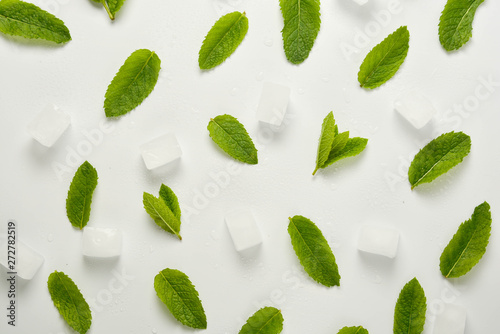 Ice cubes with mint leaves flat lay, isolated on white.