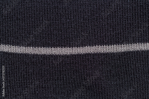 Texture textile écharpe en laine noire avec une ligne blanche