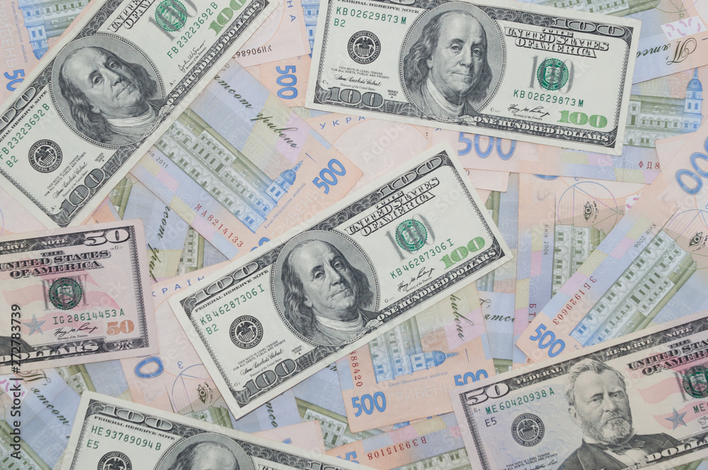 Money, dollars and hryvnia, close-up, top view. The concept of the dollar and the hryvnia, finance, banks. Money, dollars and hryvnia, close-up, top view. The concept of the dollar and the hryvnia, finance, banks.