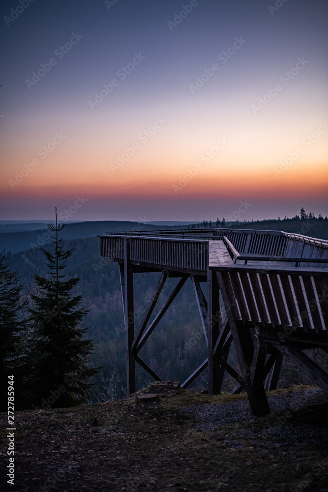 Early morning sunrise with friends at a hidden platform, Black Forest, Germany Early morning sunrise with friends at a hidden platform, Black Forest, Germany