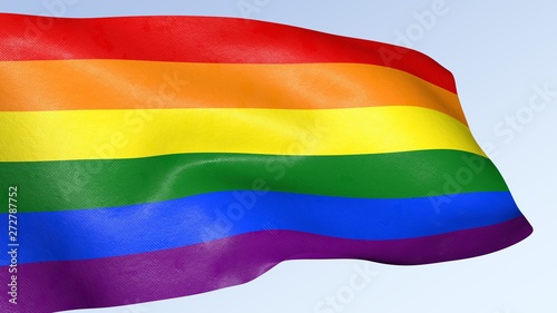 Gay pride rainbow flag waving against clean blue sky  symbol of tolerance and acceptance