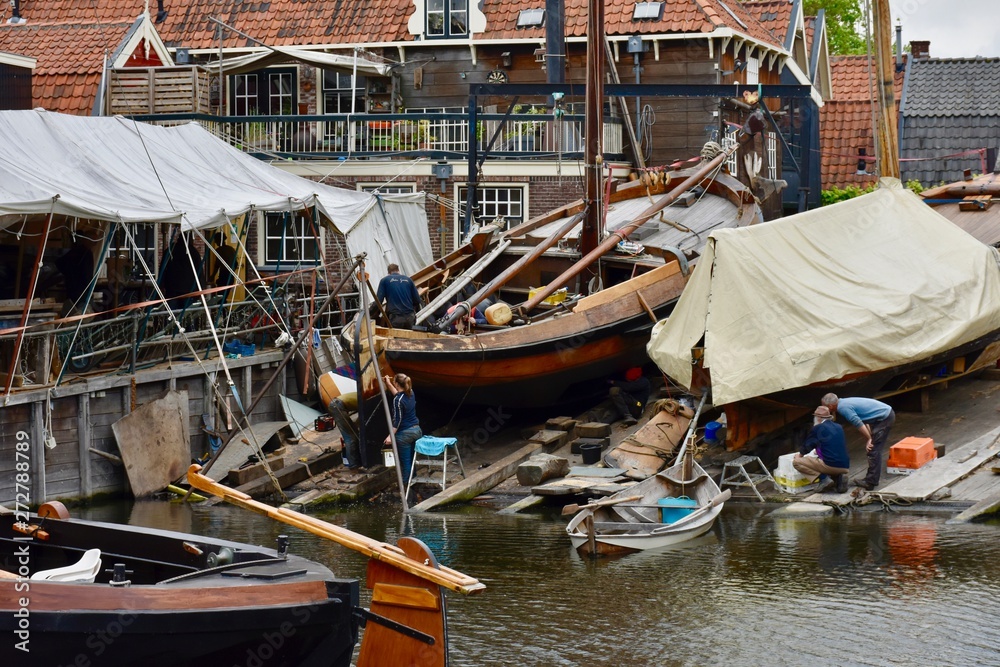People working in traditional shipyard in Spakenburg, the Netherlands.