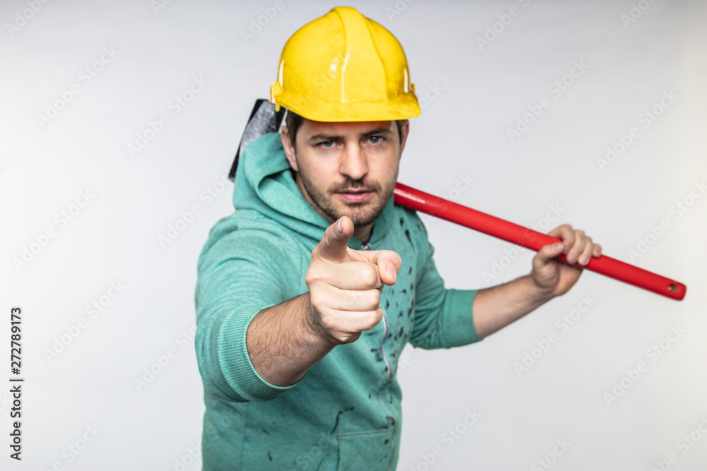 construction worker with a hammer in hand, concept of construction and disassembly, renovation construction worker with a hammer in hand, concept of construction and disassembly, renovation
