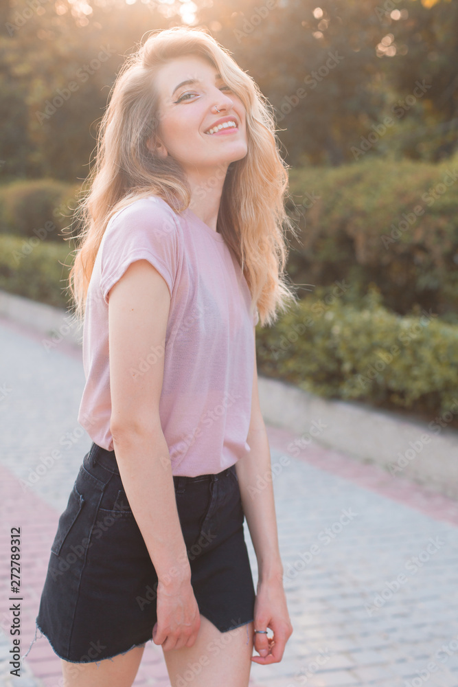 Beautiful young woman walking on the street Beautiful young woman walking on the street
