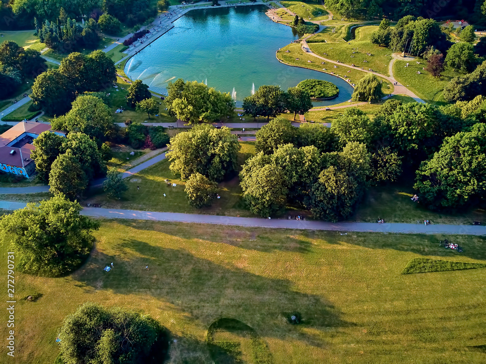 A beautiful panoramic view of the sunset in a fabulous evening in June from drone at Pola Mokotowskie in Warsaw, Poland - 