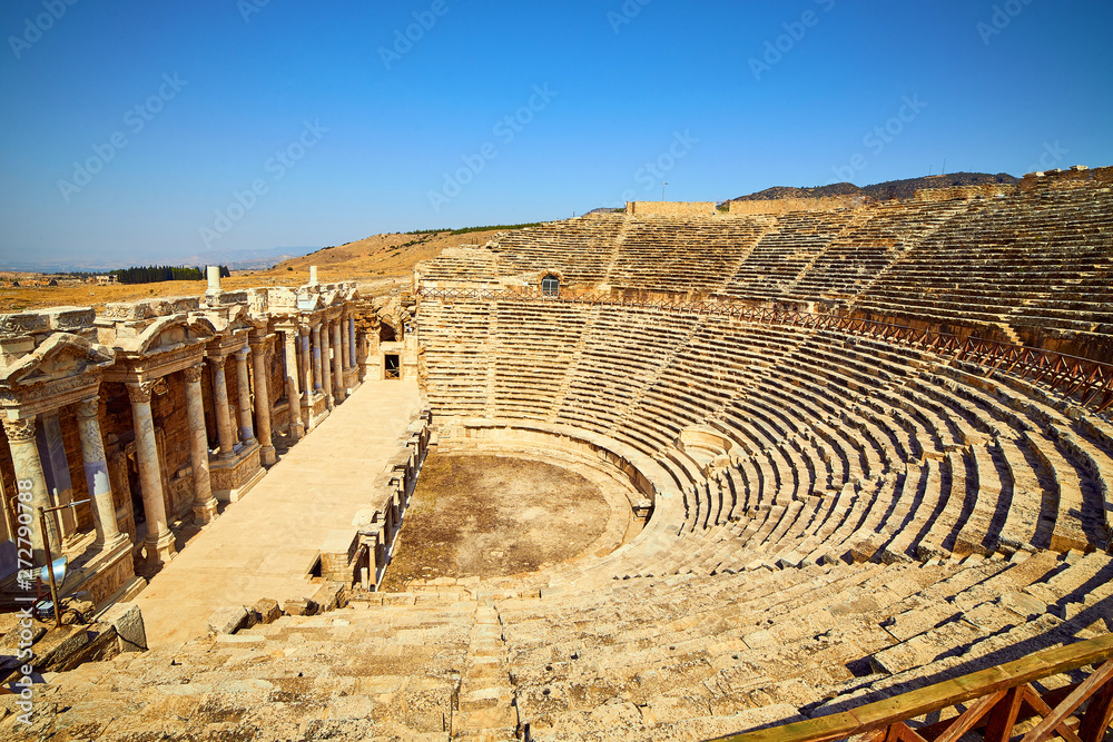 Ruins of old amphitheater, Hierapolis in Pamukkale. Is popular tourist destination in Turkey. Panorama ancient Greco Roman city