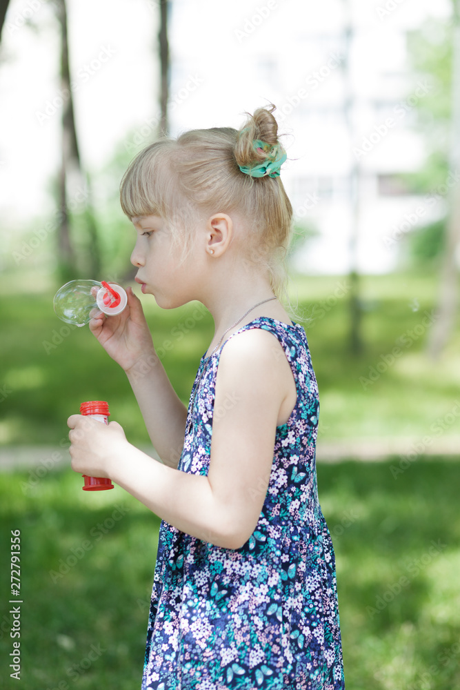Adorable little girl blowing bubble Adorable little girl blowing bubble