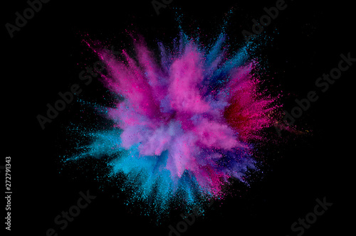 Colored powder explosion. Abstract closeup dust on backdrop. Colorful explode. Paint holi photo