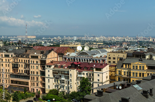 Aerial view from St. Sophia Cathedral on buildings of historical center of Kiev. Beautiful Kiev roofs. In background - modern buildings of Kiev. Kiev - capital of Ukraine - motherland of Russia
