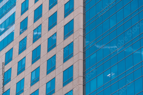 Closeup view on blue windows of modern office building. Commercial real estate business, office lease, rent concept