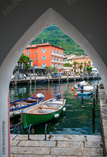 small boat harbor through the arch