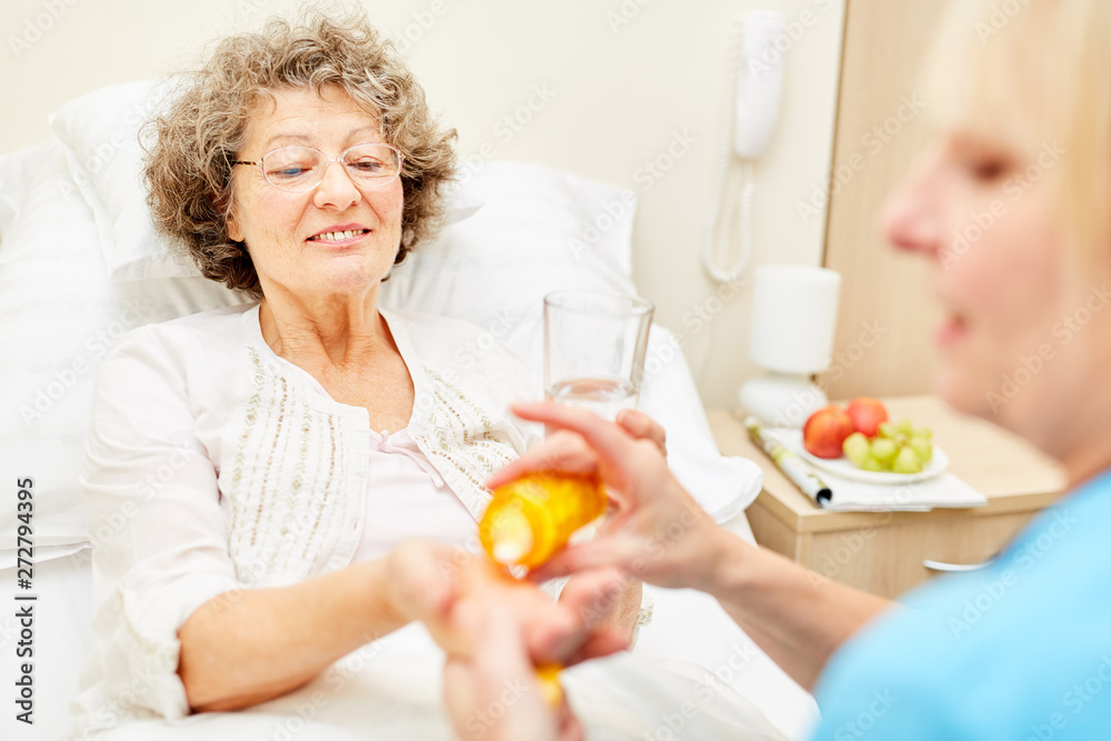 Bedridden senior woman gets medicine