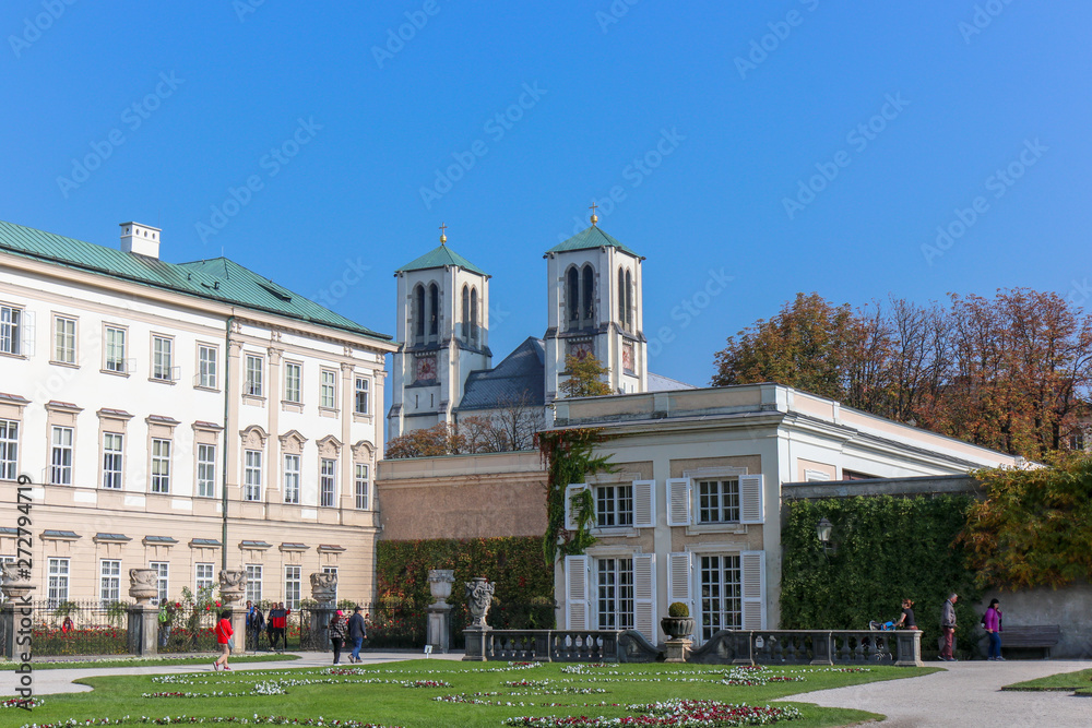 view of famous Mirabell Gardens with the old historic Fortress Hohensalzburg.