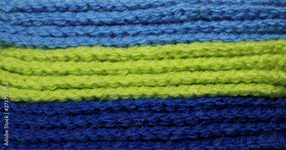 A pile of blue and green knitted elements. Warm and soft wallpaper, pattern, background A pile of blue and green knitted elements. Warm and soft wallpaper, pattern, background