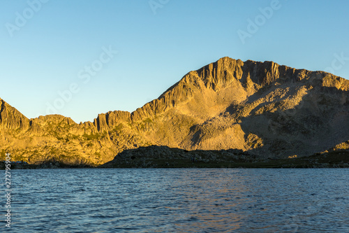 Amazing Sunset at Kamenitsa peak and Tevno lake, Pirin Mountain, Bulgaria photo