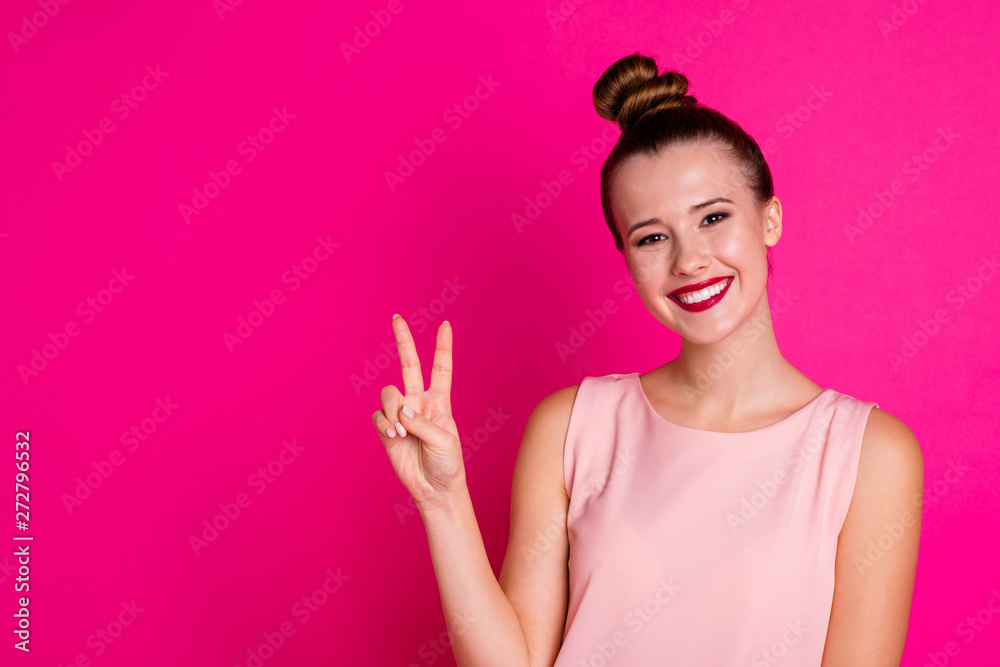 Portrait of nice lovely teen teenager make v-sign vacation student rejoice content candid dressed top-knot blouse pastel-colored lips lipstick red pomade bright isolated colorful background