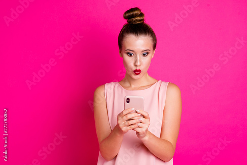Portrait cute astonihsed person people she her hold hand moderrn technology relax impressed wonder incredible information unbelievable unexpected outfit top knot isolated colorful pink background photo