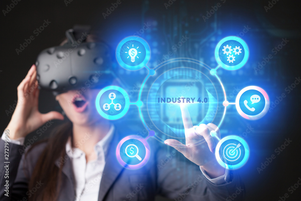 The concept of business, technology, the Internet and the network. A young entrepreneur working on a virtual screen of the future and sees the inscription: Industry 4.0 The concept of business, technology, the Internet and the network. A young entrepreneur working on a virtual screen of the future and sees the inscription: Industry 4.0