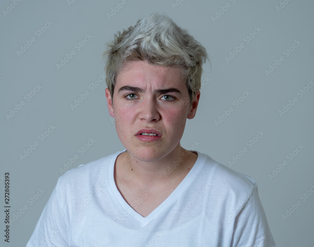 Portrait of a young teenager man with angry face looking furious. Portrait of a young teenager man with angry face looking furious.