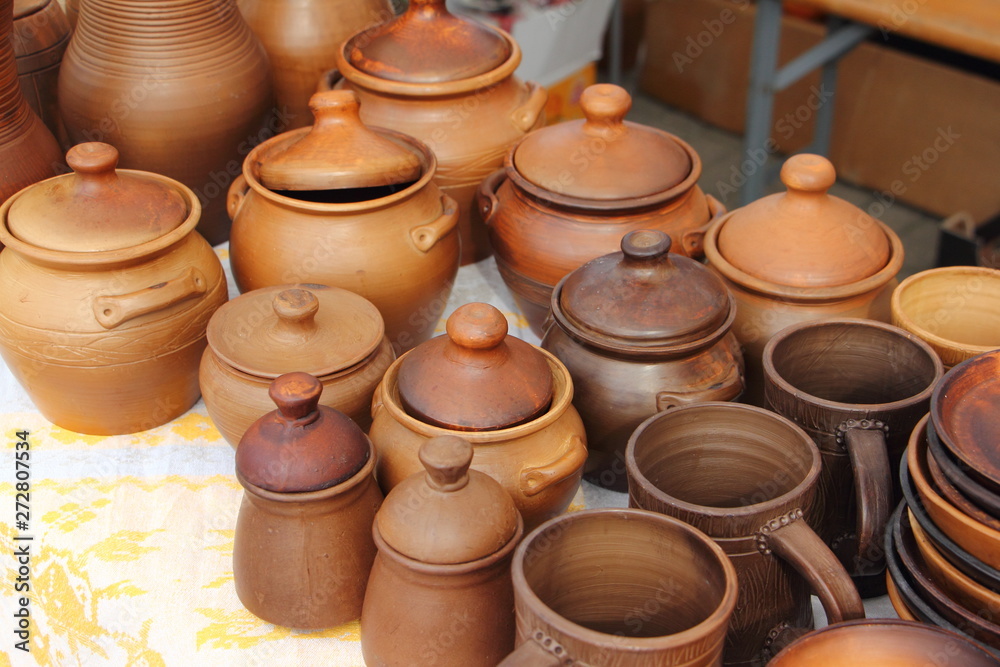 A lot of pottery on the table, ceramic traditional production