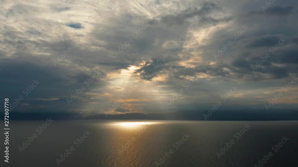 Beauty of colorful sky during the sunset from above. Beautiful sunset background from the colorful beams on the sky. Sunset over ocean. Seascape, Summer and travel vacation concept Beauty of colorful sky during the sunset from above. Beautiful sunset background from the colorful beams on the sky. Sunset over ocean. Seascape, Summer and travel vacation concept