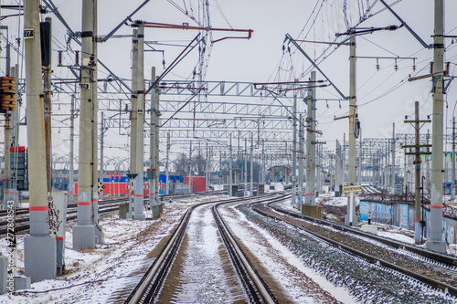 Winter Russian Railway. Public transport. winter road. Rails and sleepers. Electricity