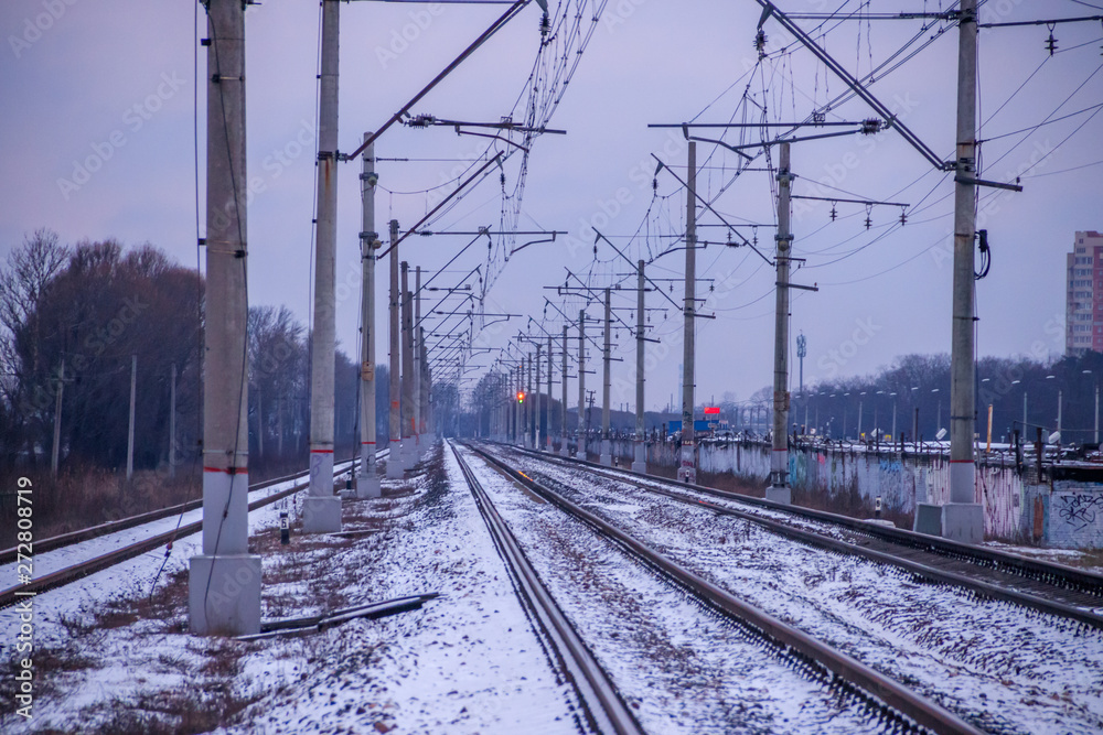 Winter Russian Railway. Public transport. winter road. Rails and sleepers. Electricity Winter Russian Railway. Public transport. winter road. Rails and sleepers. Electricity
