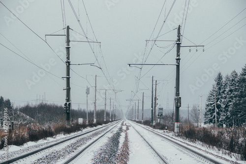 Winter Russian Railway. Public transport. winter road. Rails and sleepers. Electricity