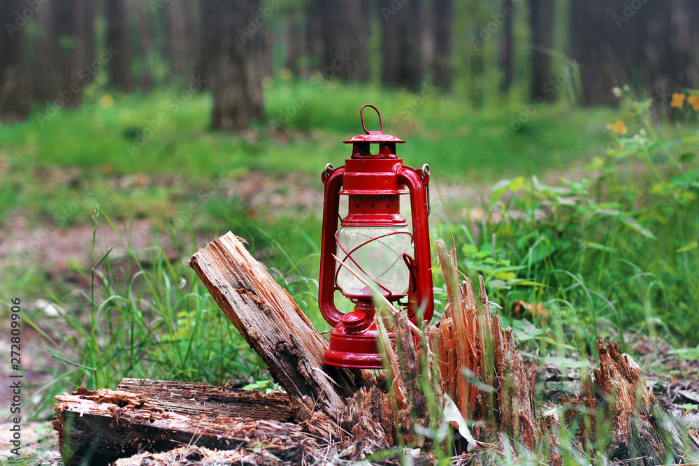 Kerosene lamp in the forest. Abstract photo Kerosene lamp in the forest. Abstract photo