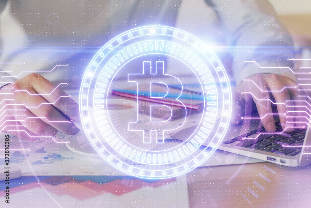 Crypto currency theme hologram with businessman working on computer on background. Concept of blockchain. Double exposure. Crypto currency theme hologram with businessman working on computer on background. Concept of blockchain. Double exposure.